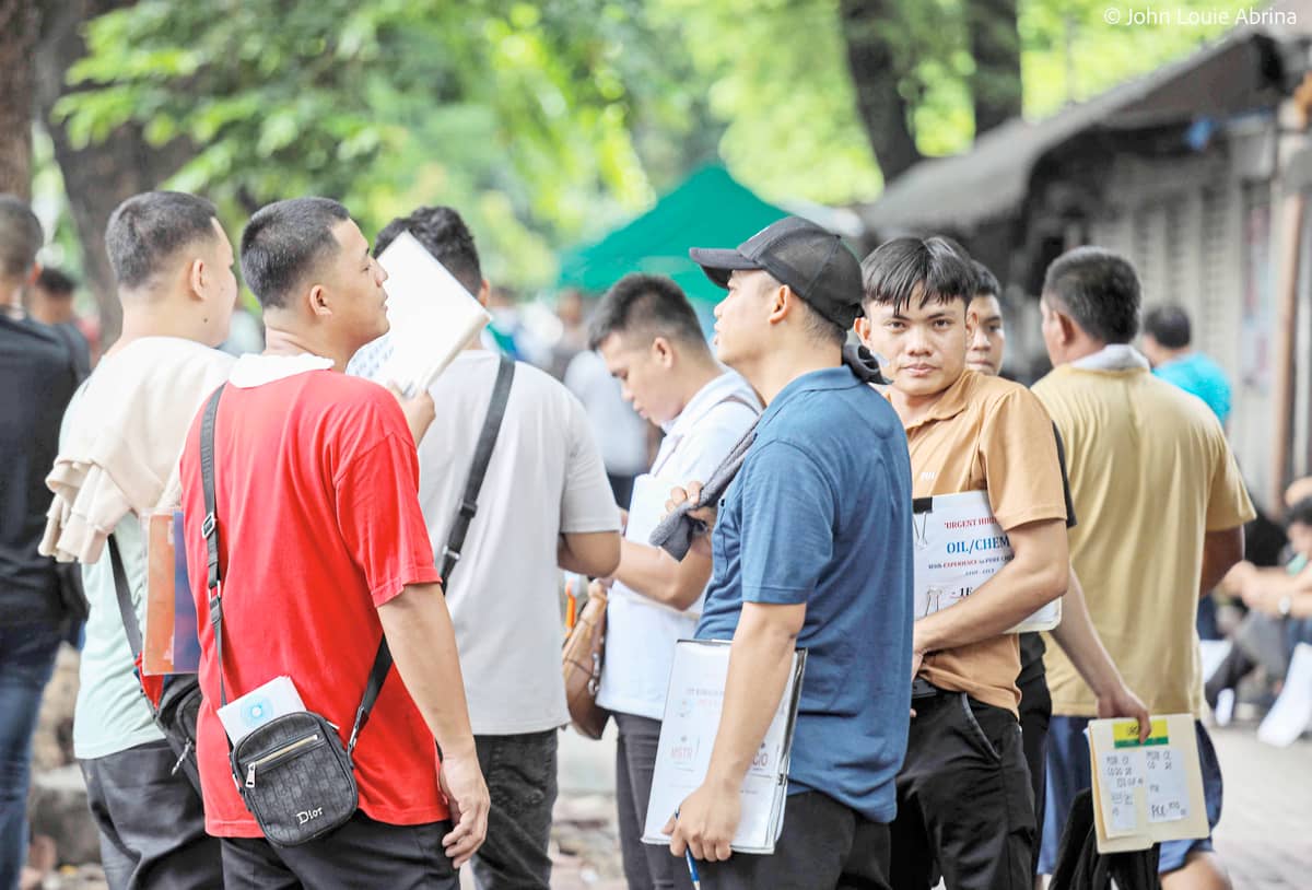Seafarers seek jobs at shipping companies along T.M. Kalaw, Manila. The Department of Migrant Workers encourages companies to hire Filipino seafarers.